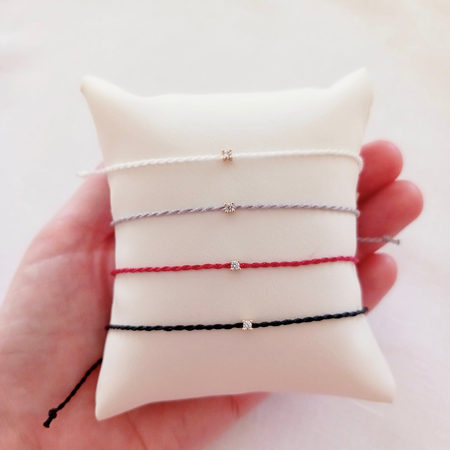 Delicate gold zirconia string bracelet