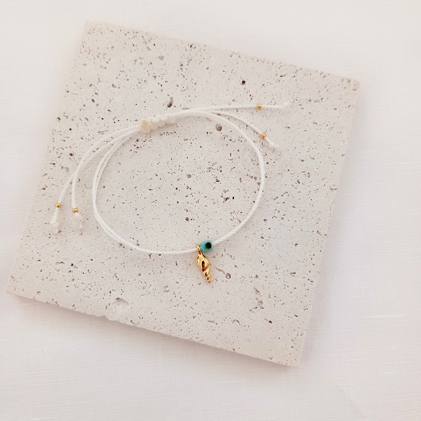 Tiny adjustable cord bracelet with sea charms