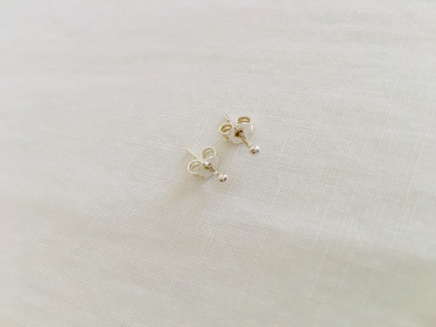 Tiny silver stud earring