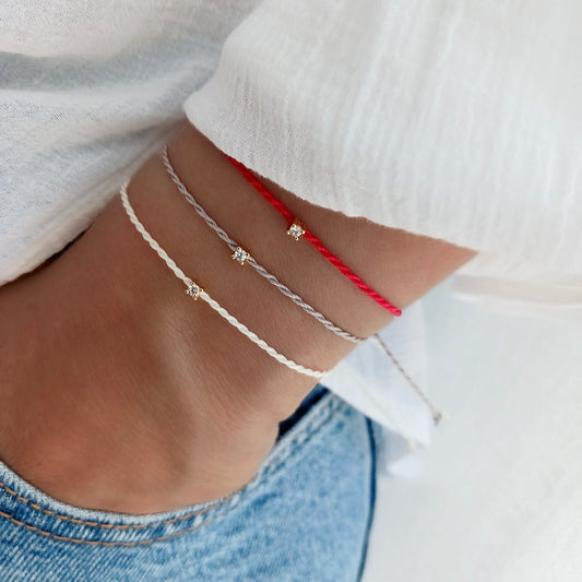 Delicate gold zirconia string bracelet