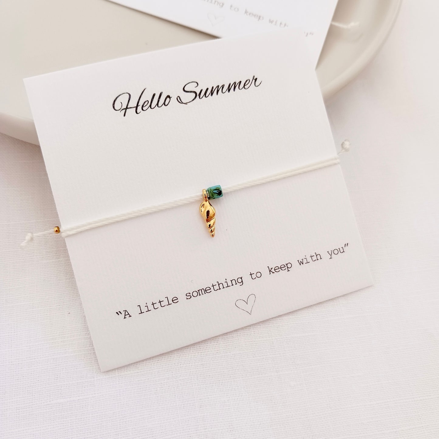 Tiny adjustable cord bracelet with sea charms