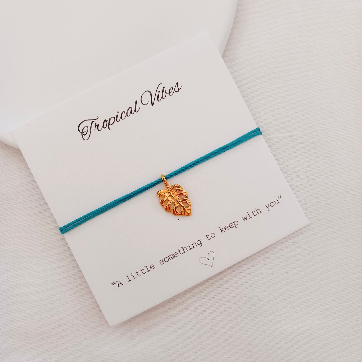 Cord bracelet with monstera charm