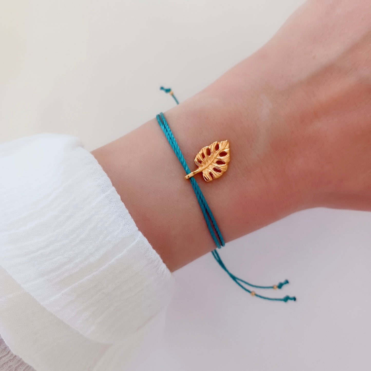 Cord bracelet with monstera charm