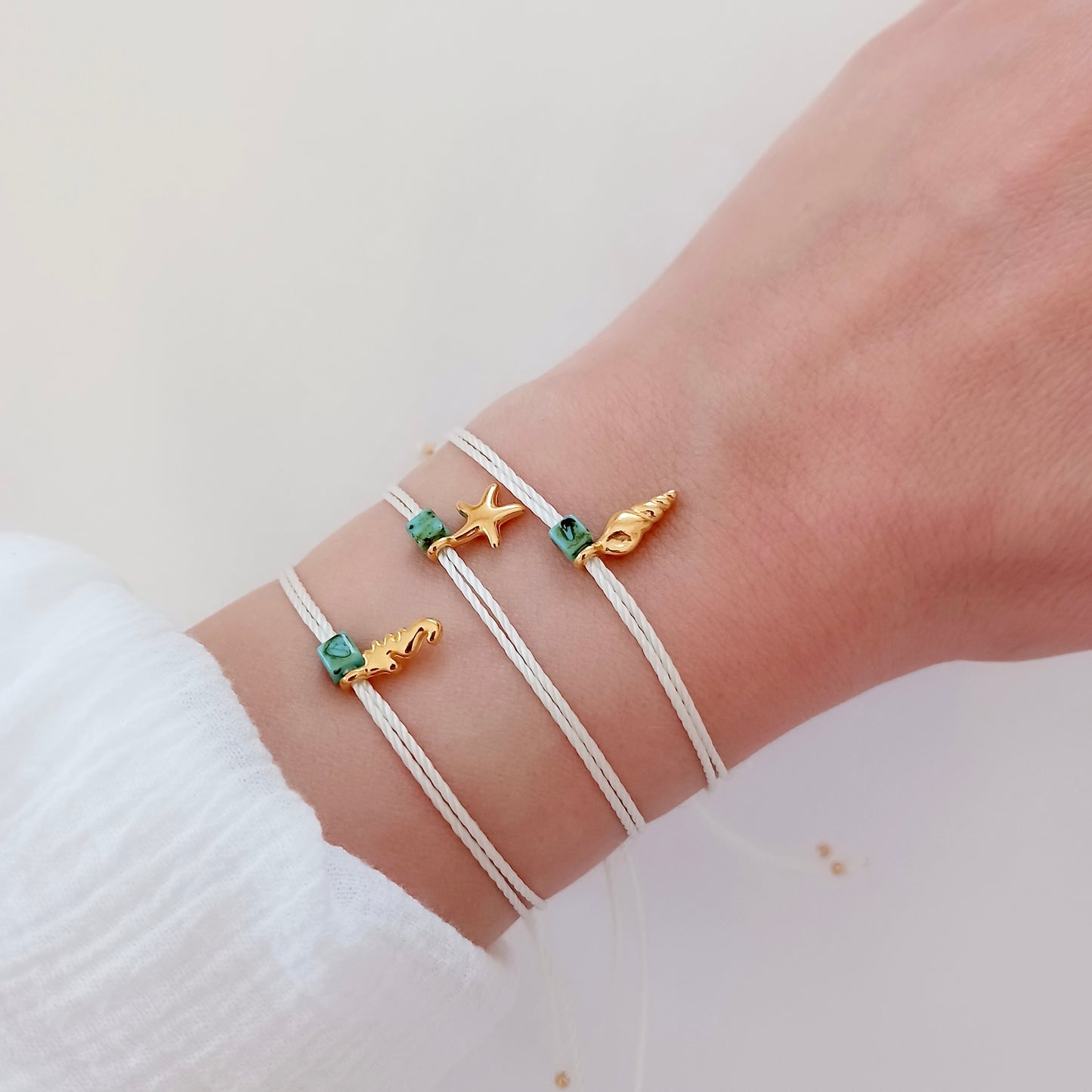 Tiny adjustable cord bracelet with sea charms