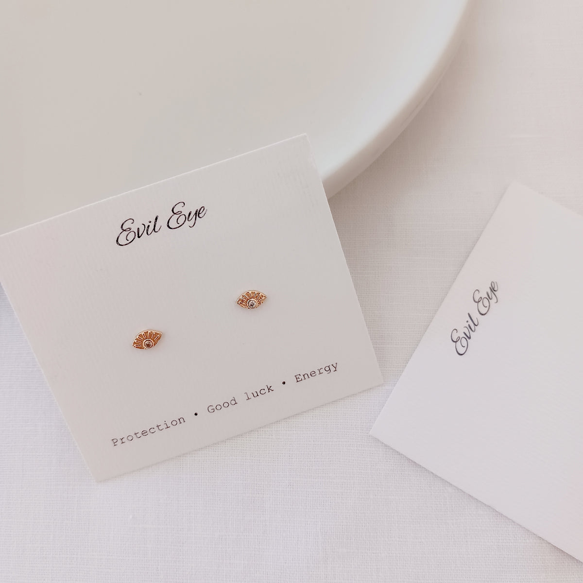 Mini evil eye stud earrings
