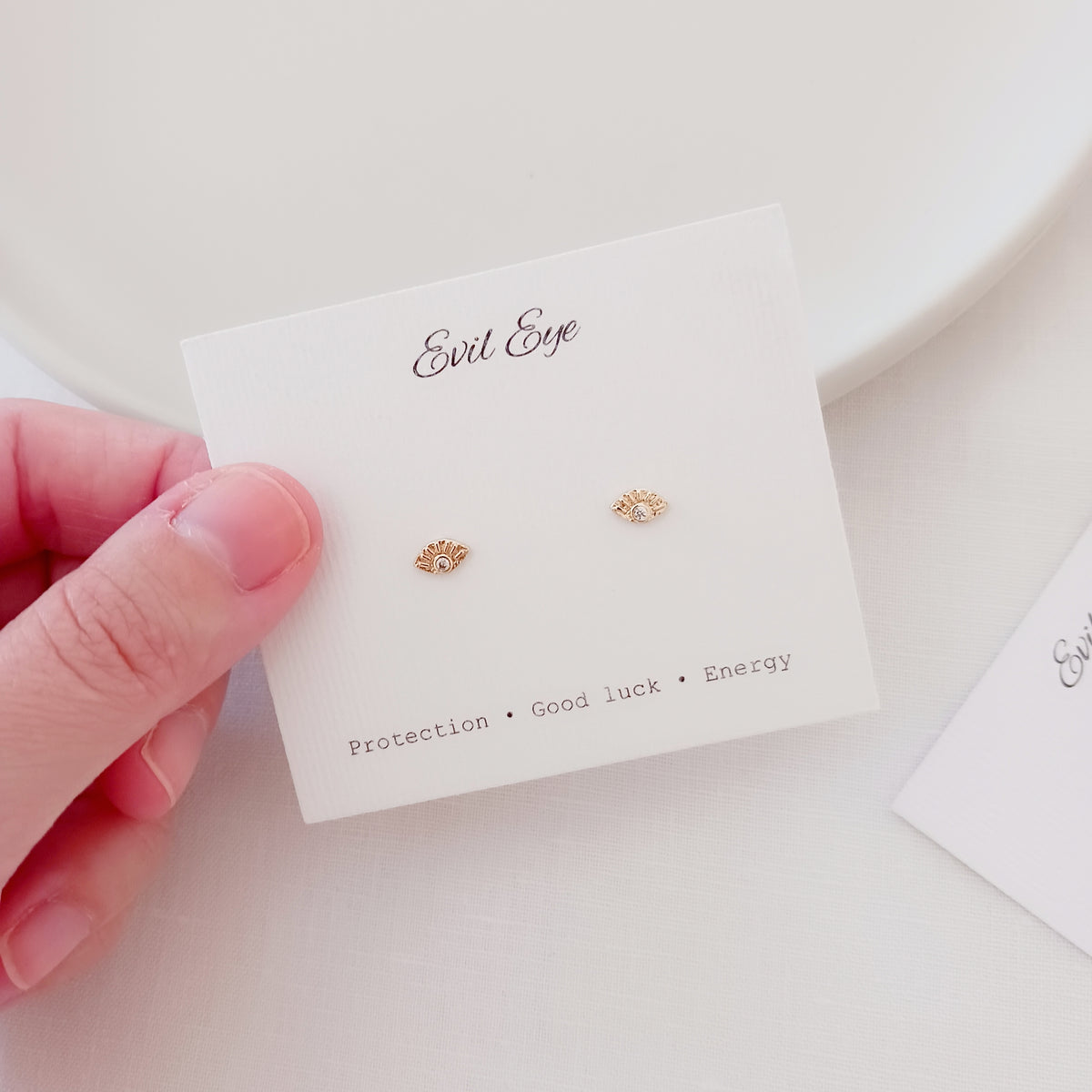 Mini evil eye stud earrings