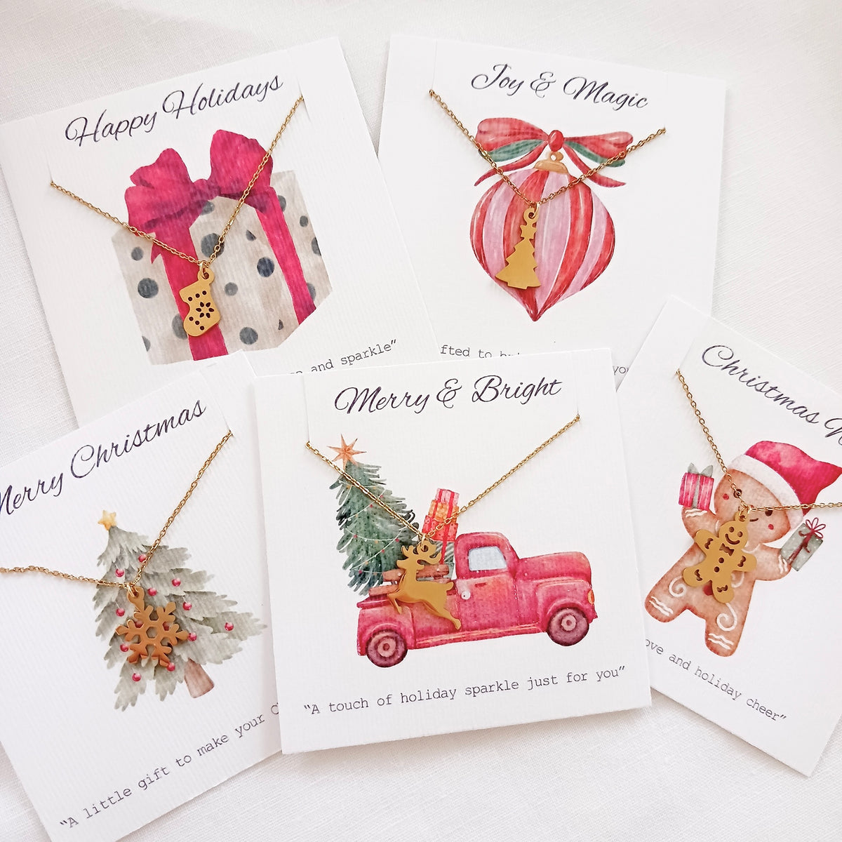 Stainless steel christmas tree chain necklace on holiday message card