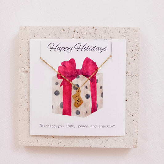 Stainless steel christmas stocking chain necklace on holiday message card