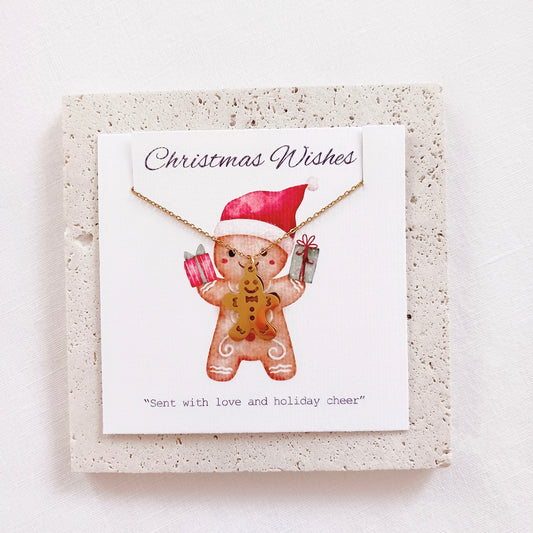 Stainless steel christmas gingerbread man necklace on holiday message card