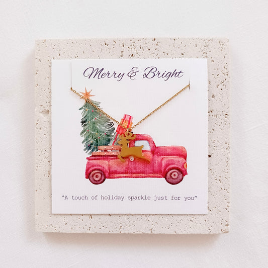 Stainless steel christmas reindeer chain necklace on holiday message card