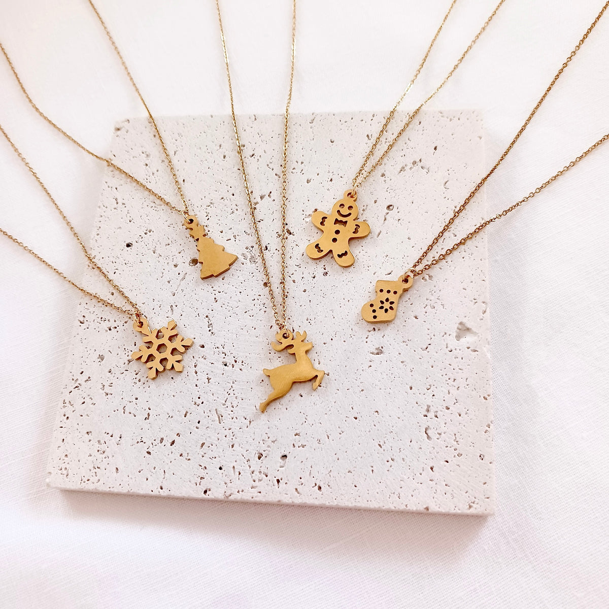 Stainless steel christmas tree chain necklace on holiday message card