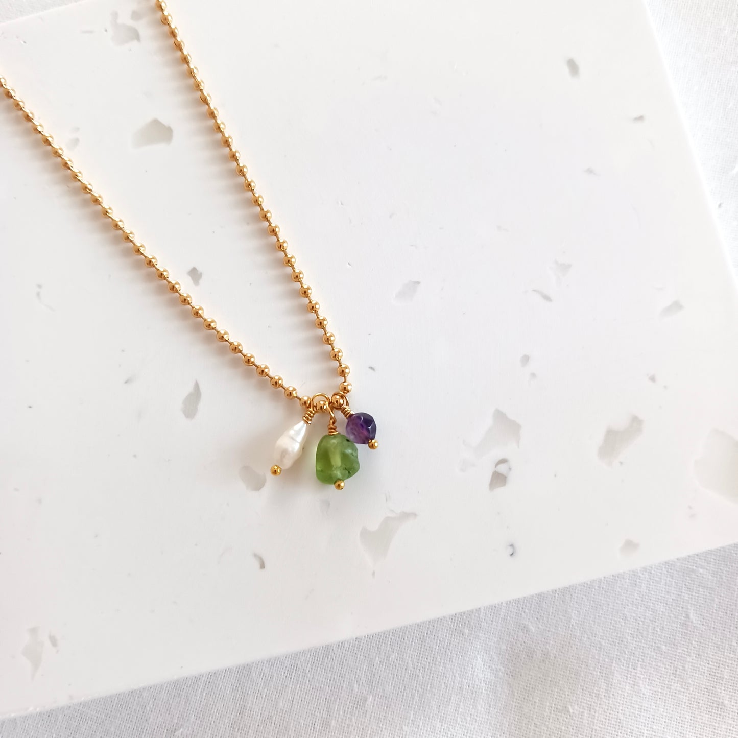 Gold necklace with mini gemstones