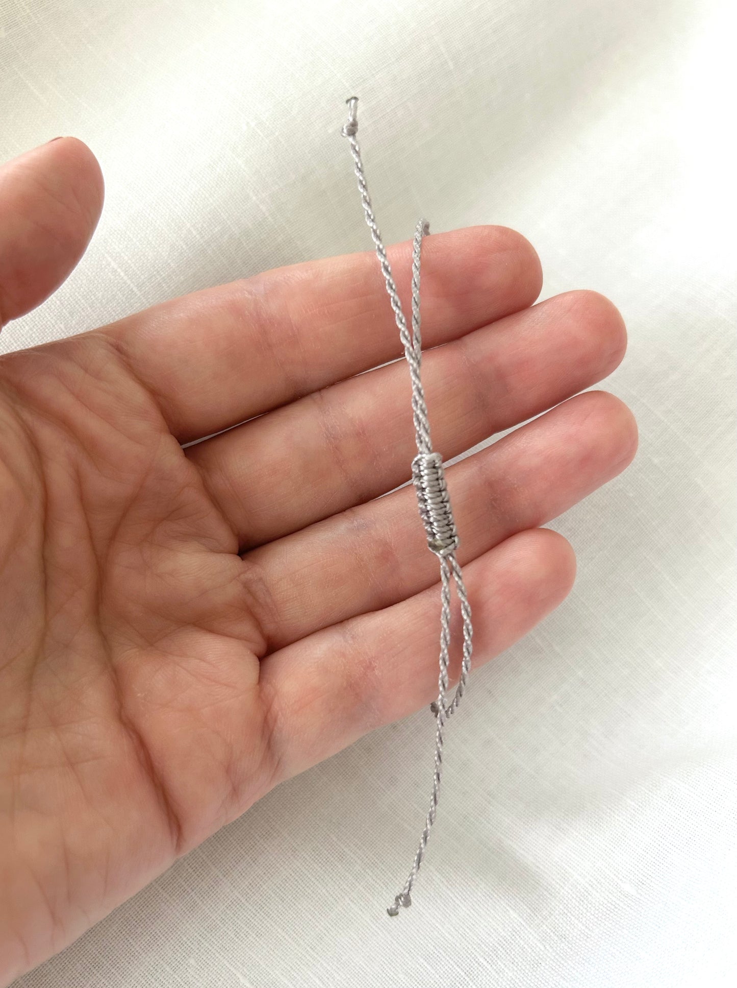 Delicate gold zirconia string bracelet